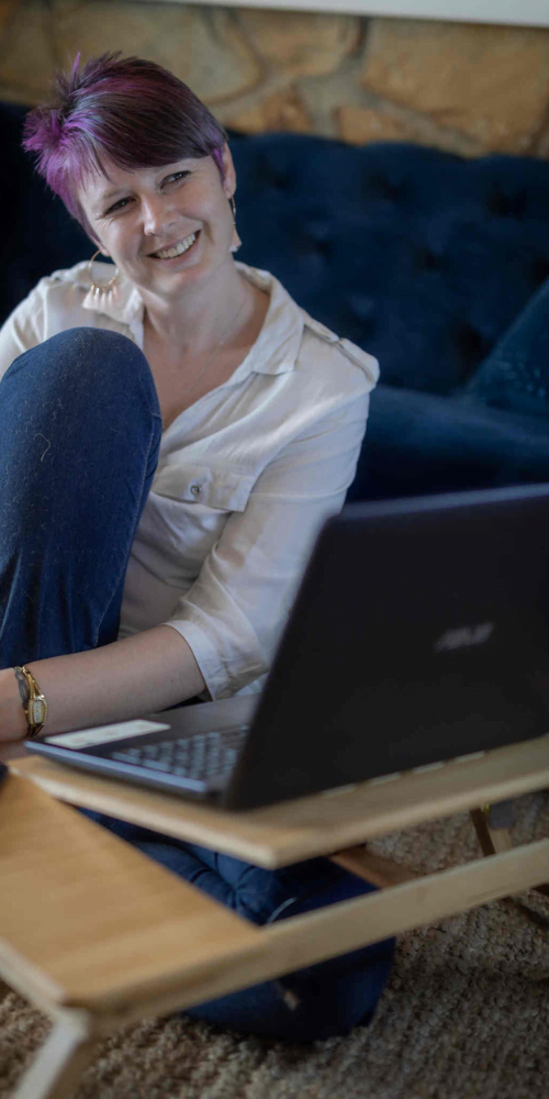Chantelle sitting in front of her laptop